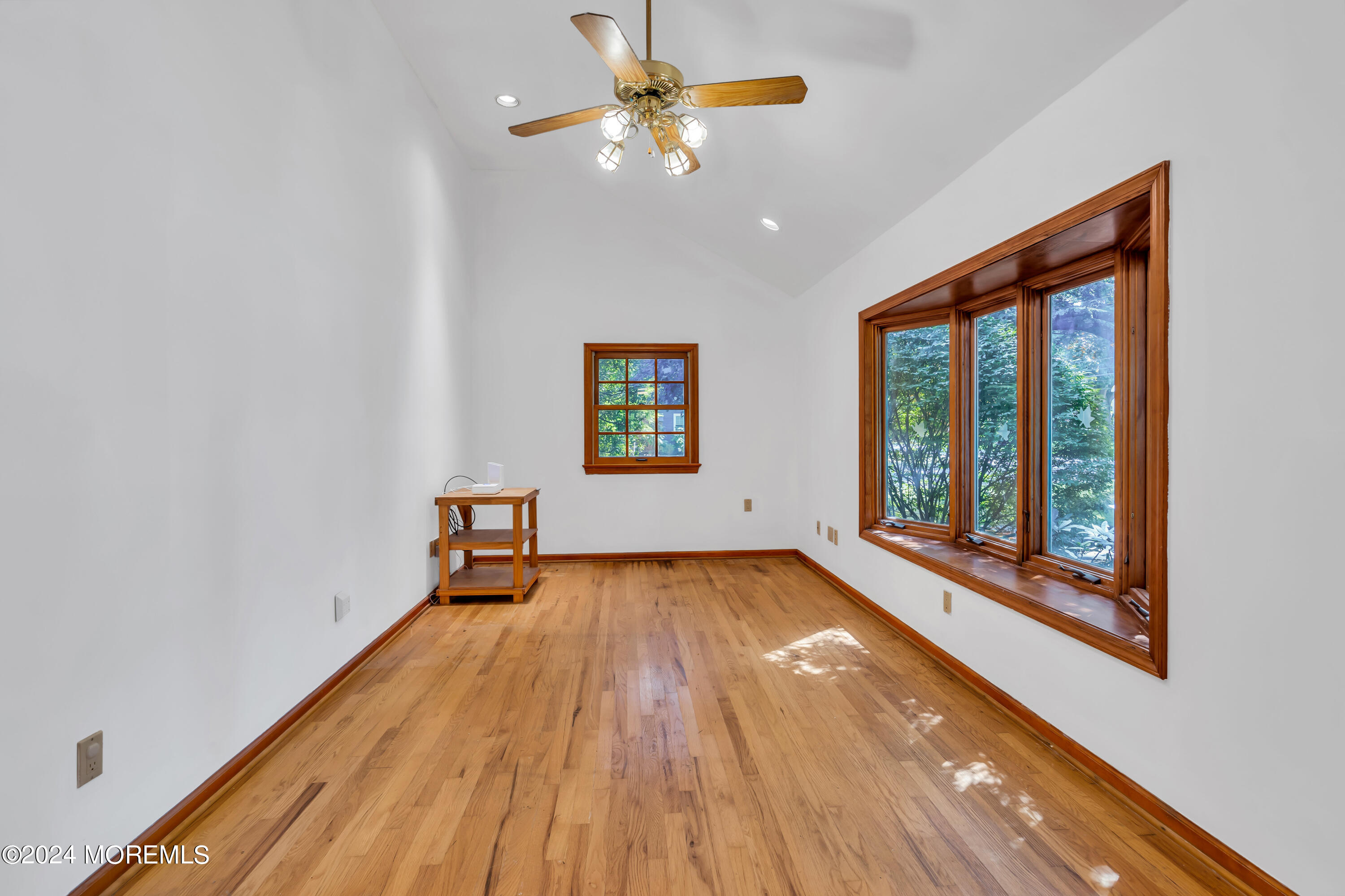 85 Hance Road Fair Haven, NJ 07704 - Photo 15 of 42 a view of a room with wooden floor and a ceiling fan