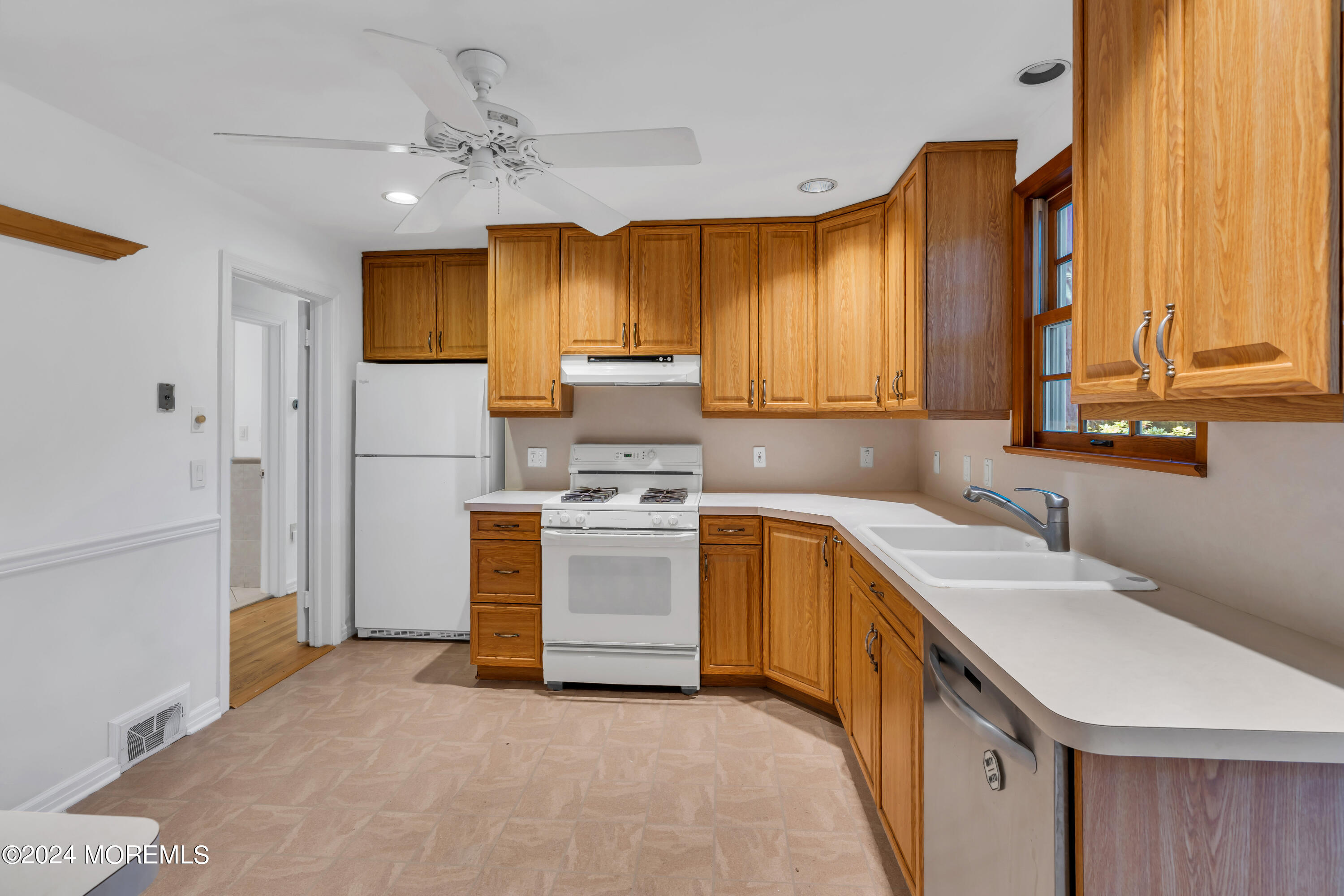 85 Hance Road Fair Haven, NJ 07704 - Photo 17 of 42 a kitchen with a sink cabinets stainless steel appliances and a window