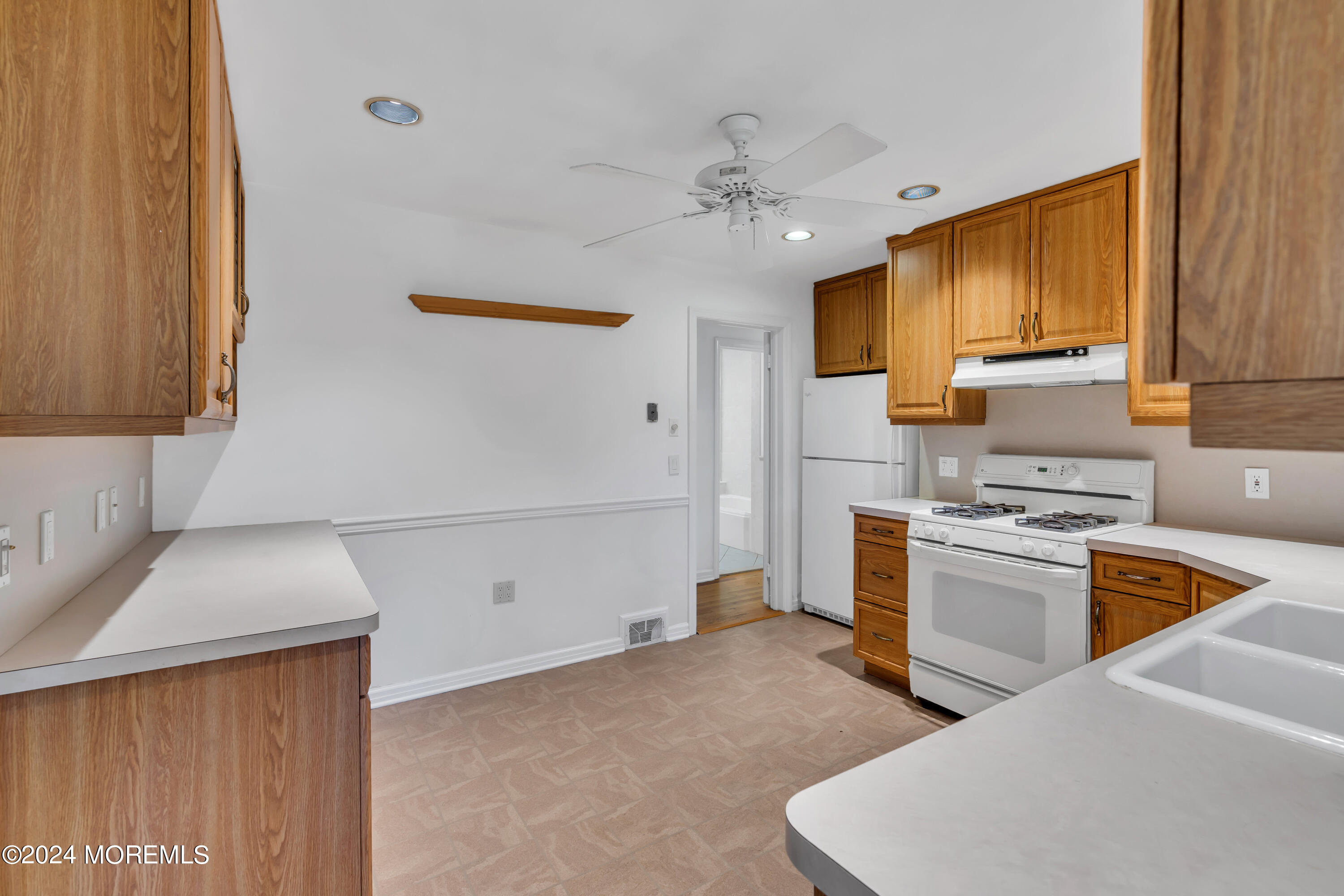 85 Hance Road Fair Haven, NJ 07704 - Photo 18 of 42 a kitchen with a sink appliances and cabinets