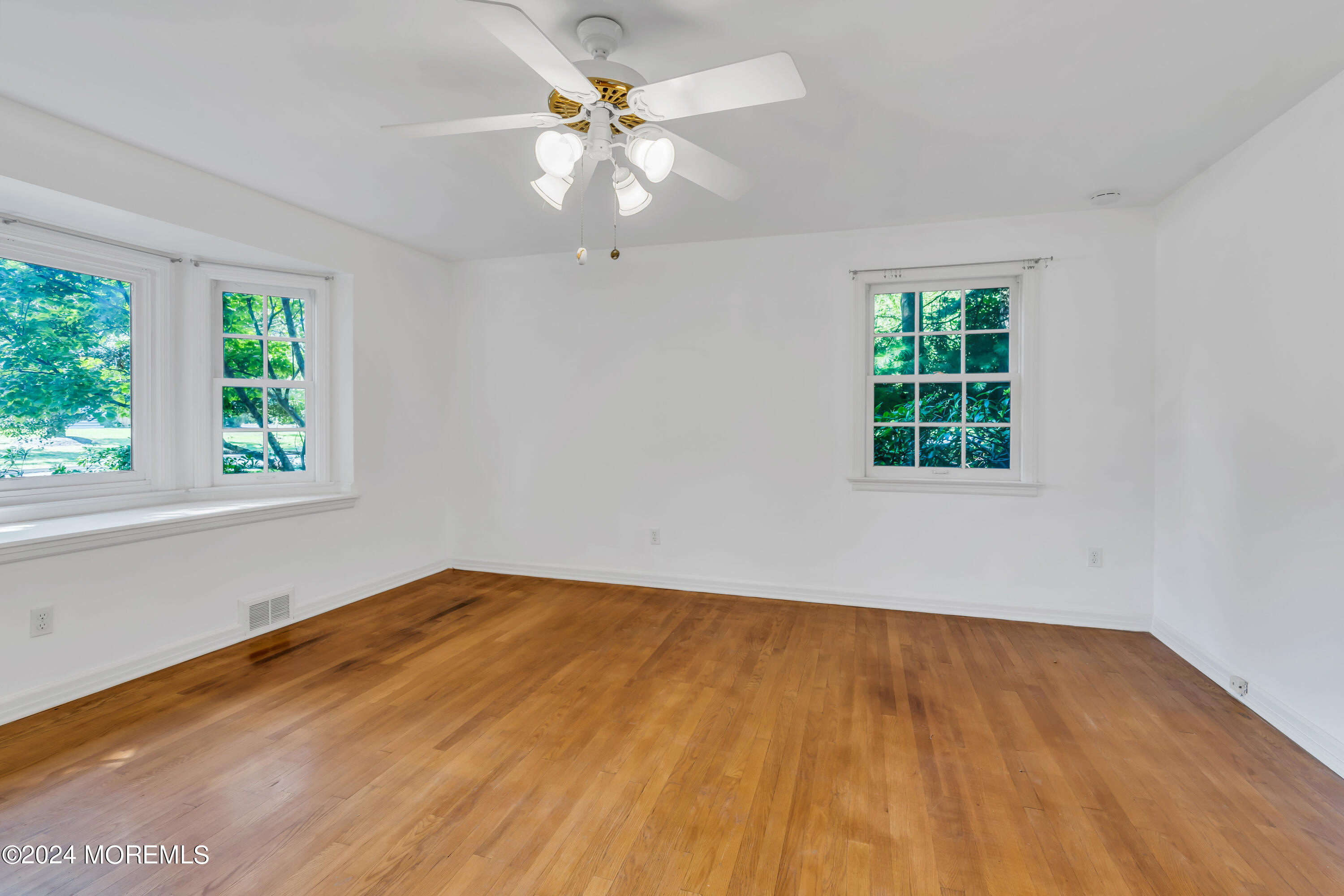 85 Hance Road Fair Haven, NJ 07704 - Photo 20 of 42 wooden floor in an empty room with a window