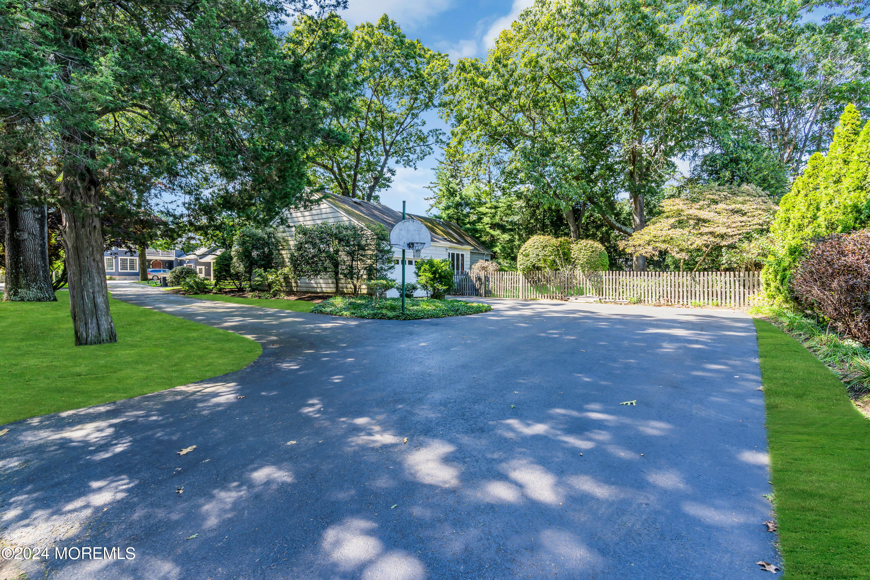 85 Hance Road Fair Haven, NJ 07704 - Photo 30 of 42 a view of a tree in front of a house