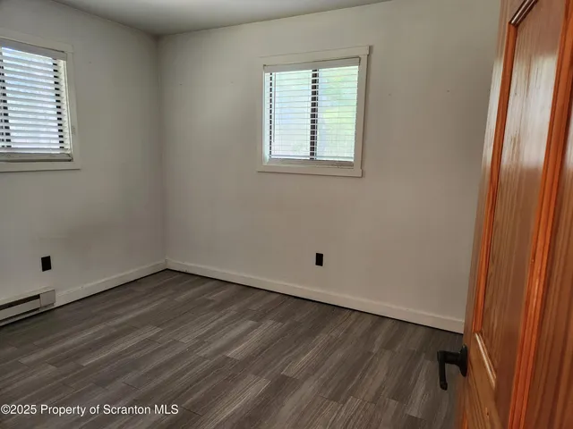 a white toilet sitting next to a shower curtain
