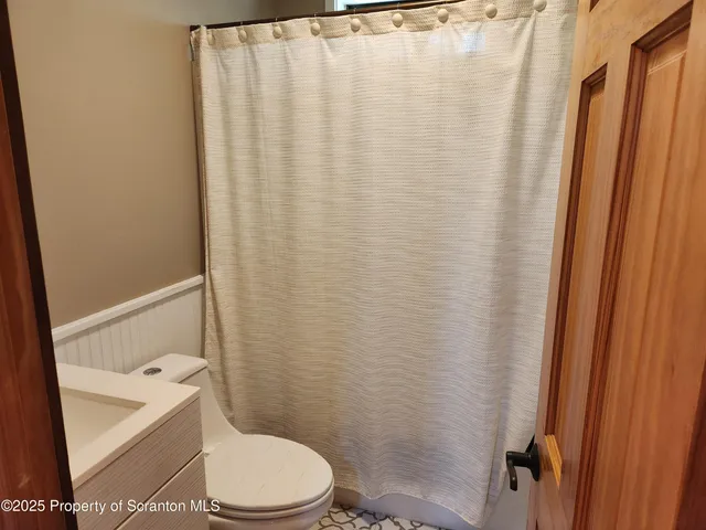 a bathroom with a toilet and a sink