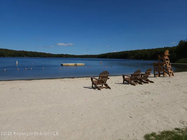 a view of a lake with houses in background