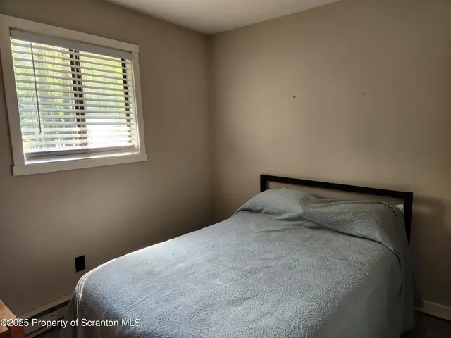 a view of empty room with stairs