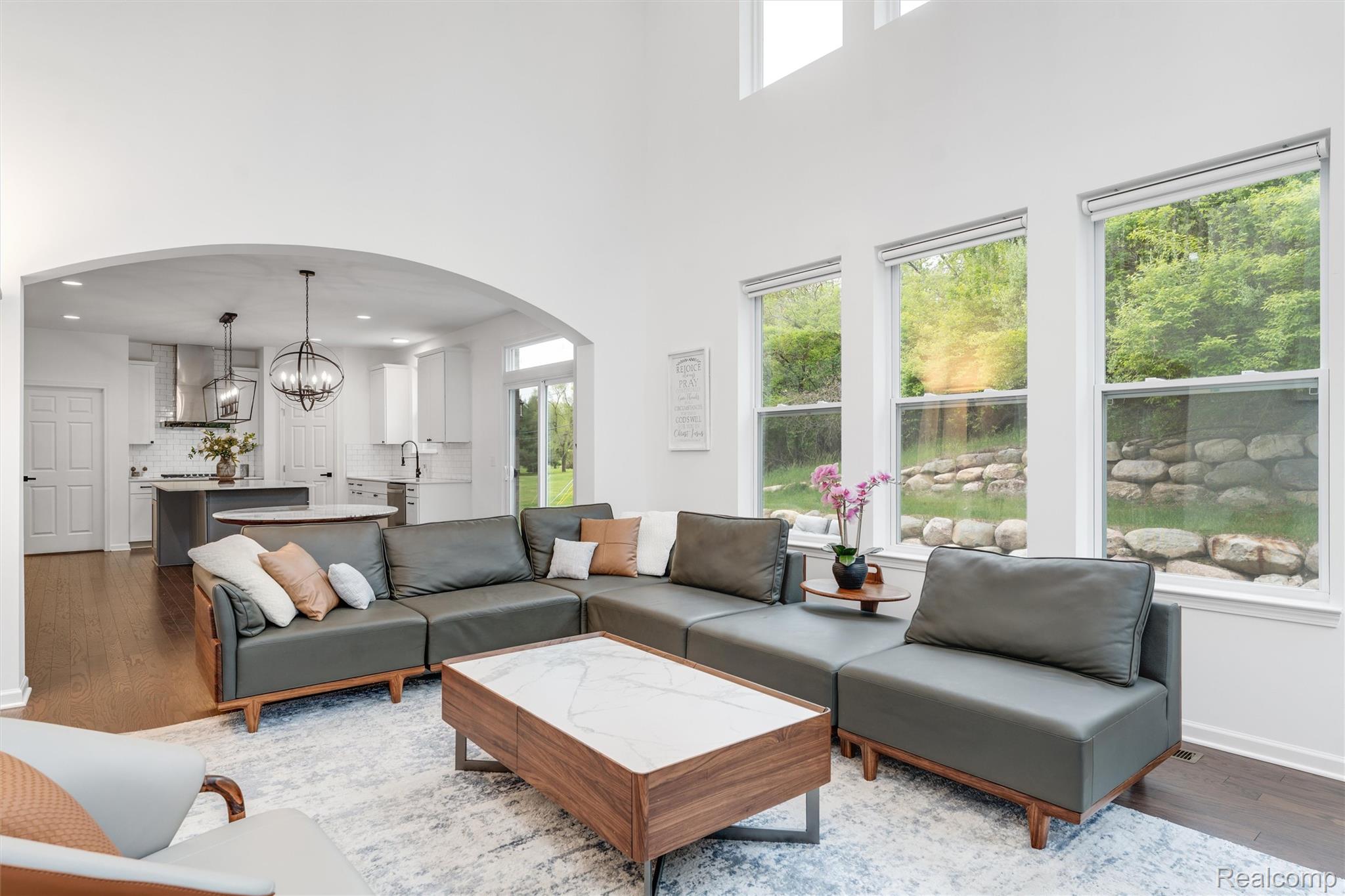908 South Livernois Road Rochester, MI 48309 - Photo 16 of 49 Living area with hanging lights, dark wood finished floors, and arched walkways