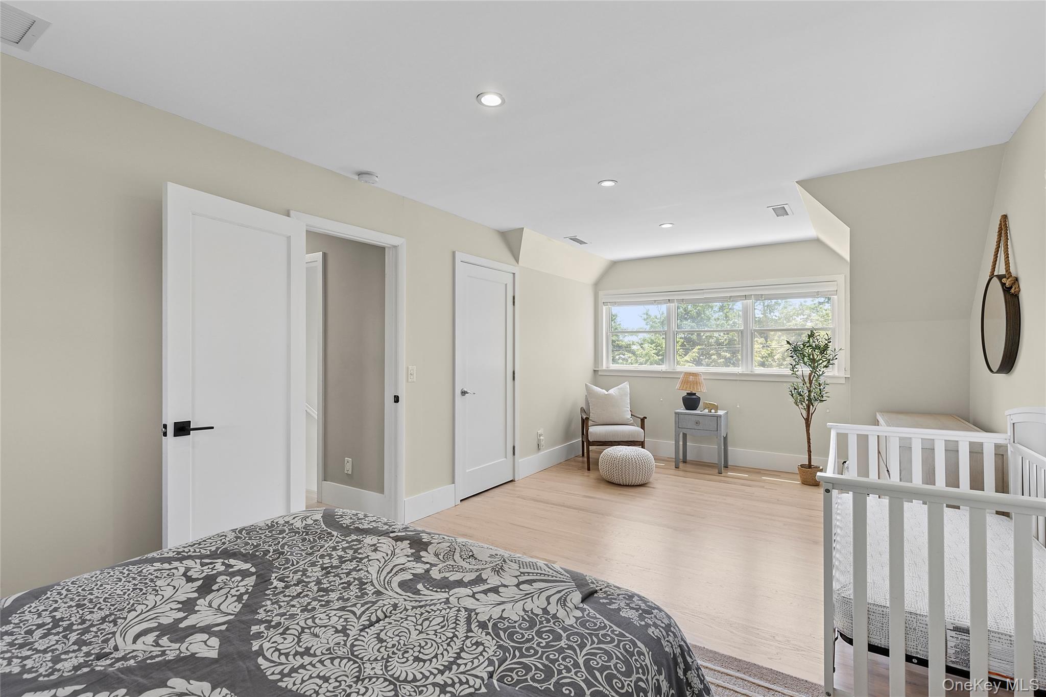 31 Highland Road Southampton, NY 11968 - Photo 11 of 19 a bedroom with a bed and glass door