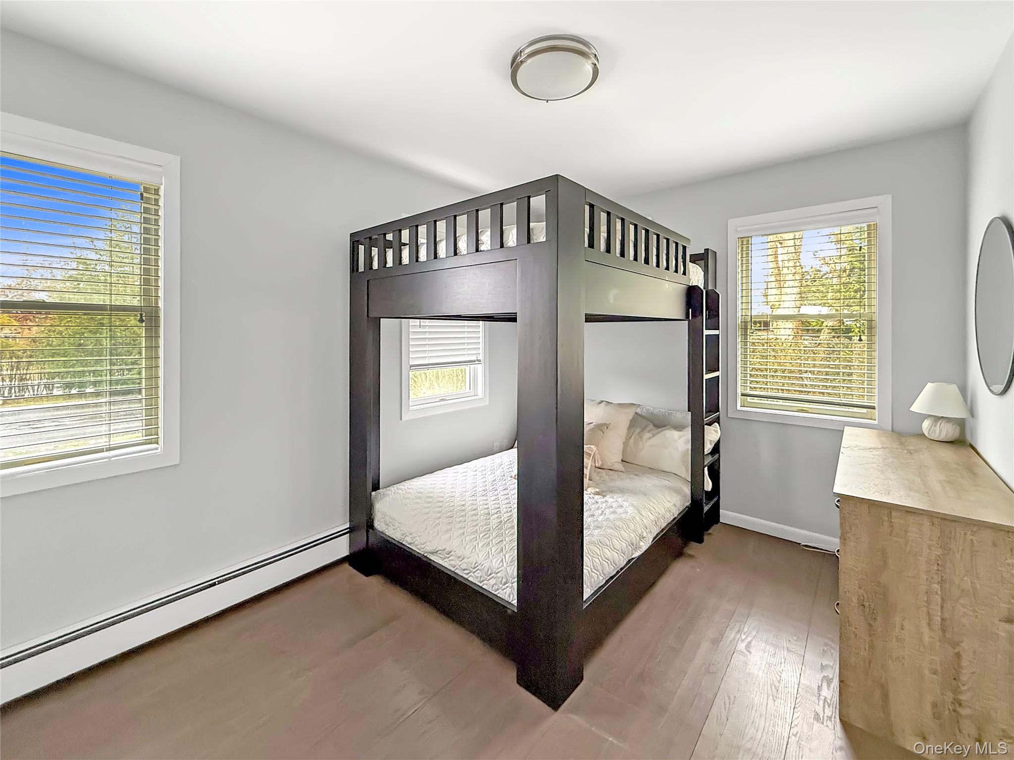 31 Highland Road Southampton, NY 11968 - Photo 13 of 19 a bedroom with a bed and a window