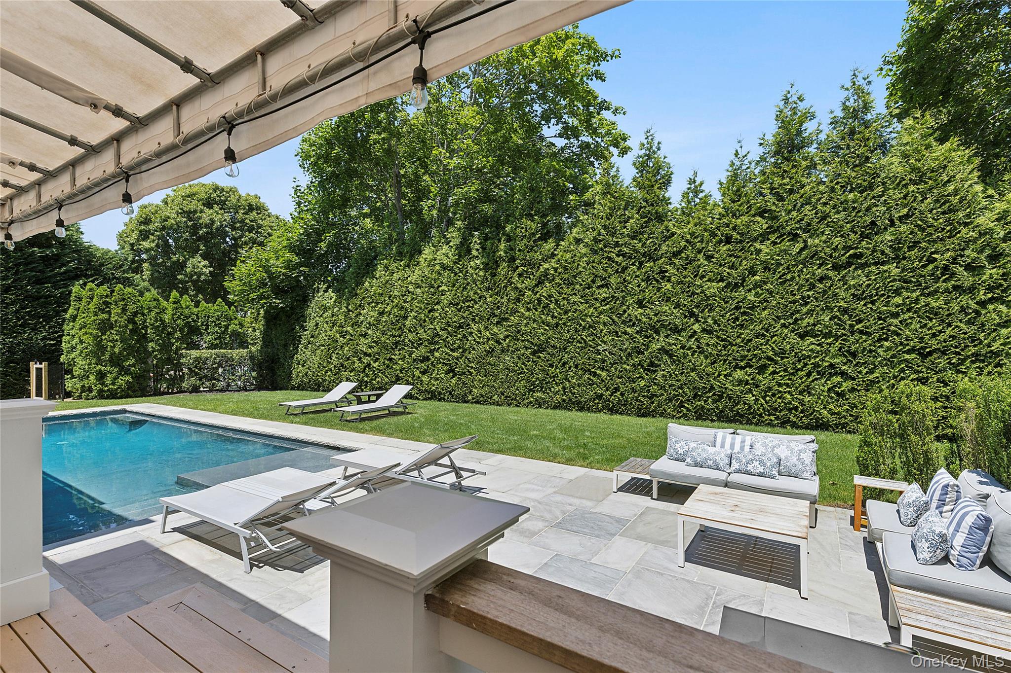 31 Highland Road Southampton, NY 11968 - Photo 19 of 19 a view of a backyard with sitting area