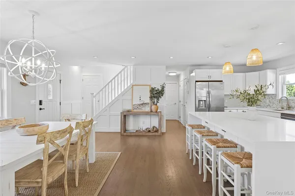a dining room with furniture and wooden floor