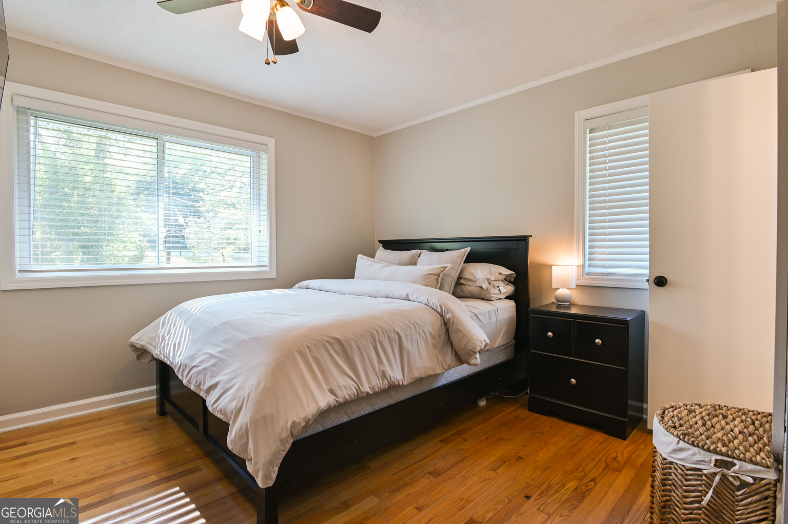 545 Forest Hill Road Macon, GA 31210 - Photo 50 of 63 a bedroom with a bed and a chandelier
