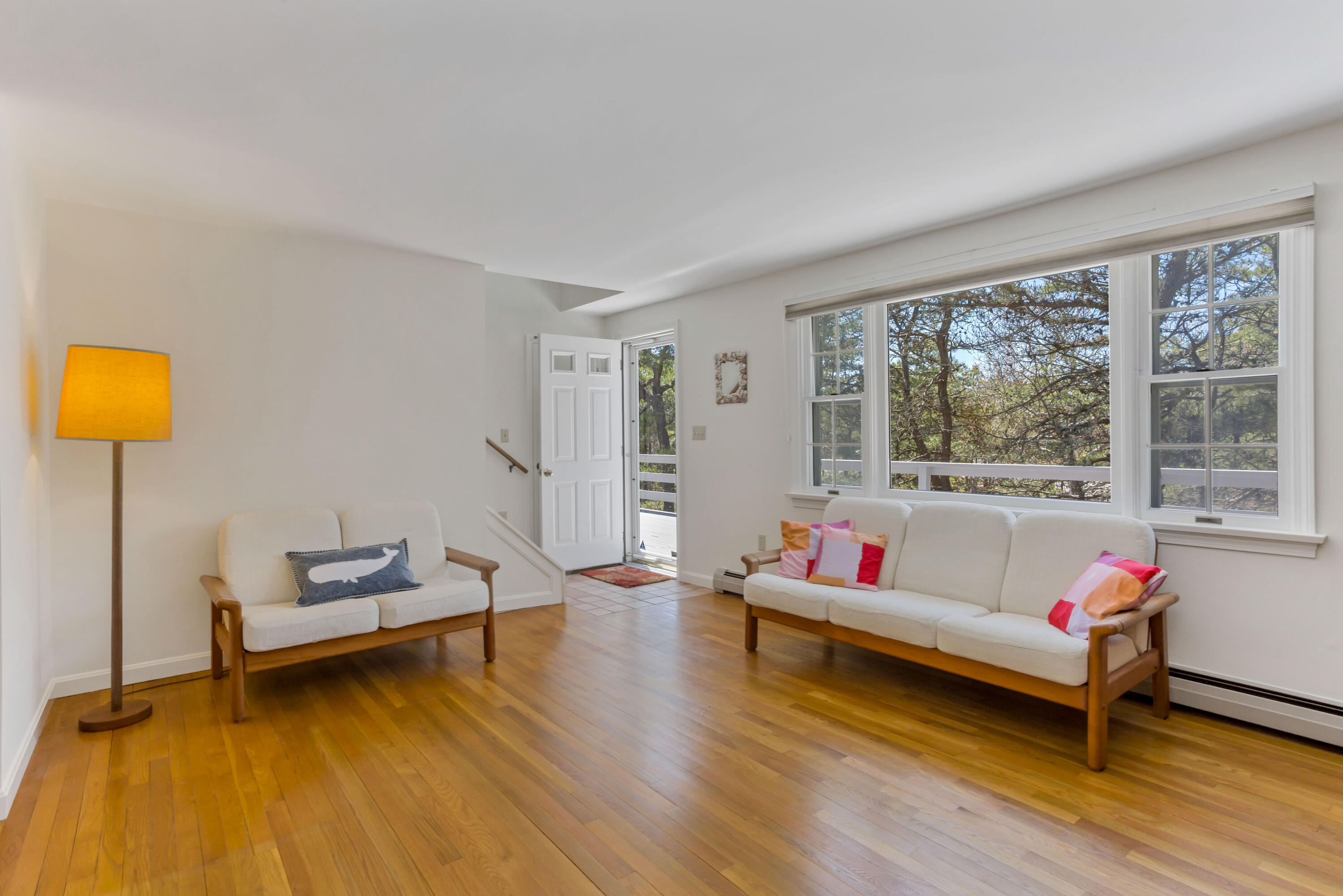 140 Salt Works Road Eastham, MA 02642 - Photo 11 of 49 a living room with furniture and a wooden floor