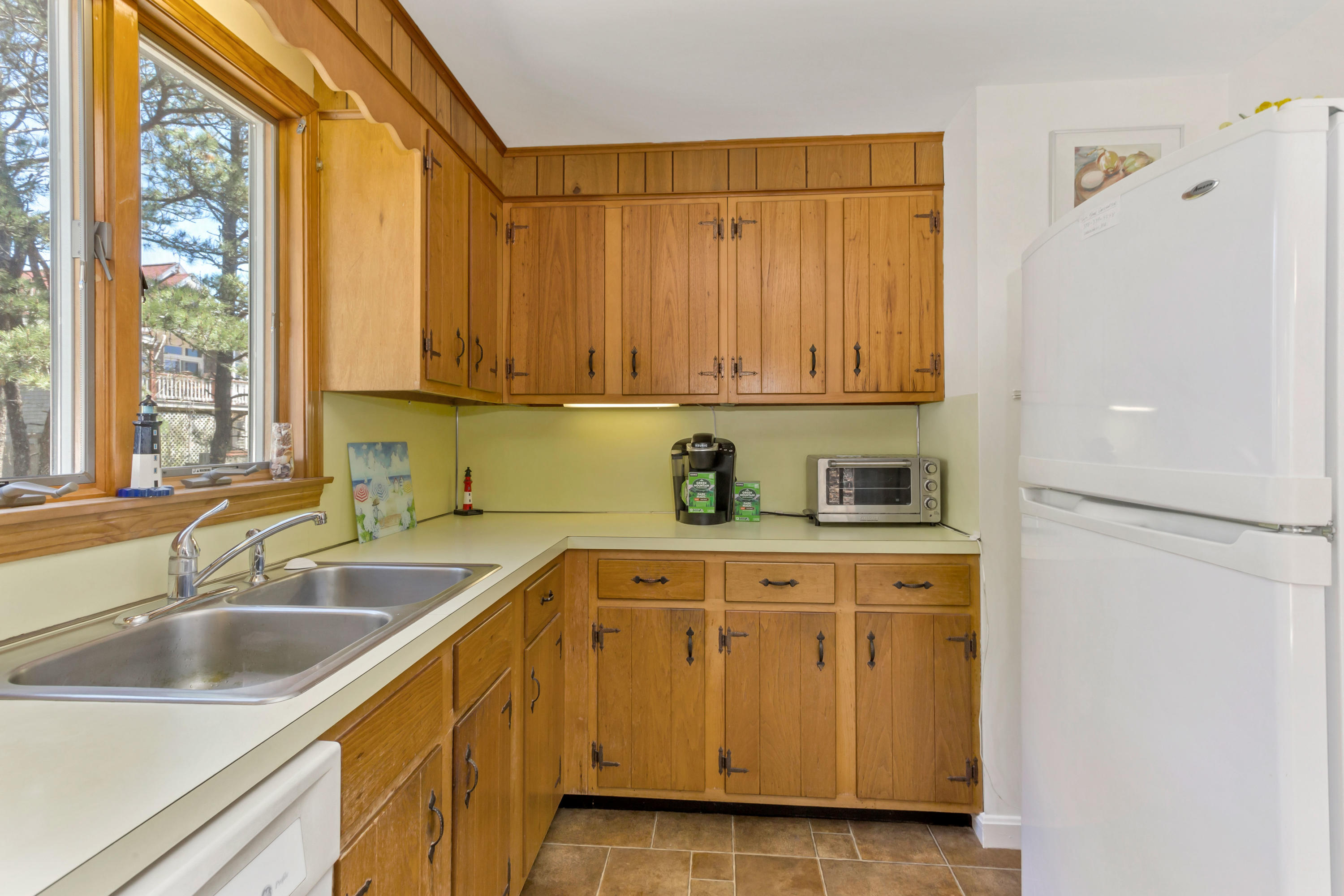 140 Salt Works Road Eastham, MA 02642 - Photo 17 of 49 a kitchen with a sink and cabinets