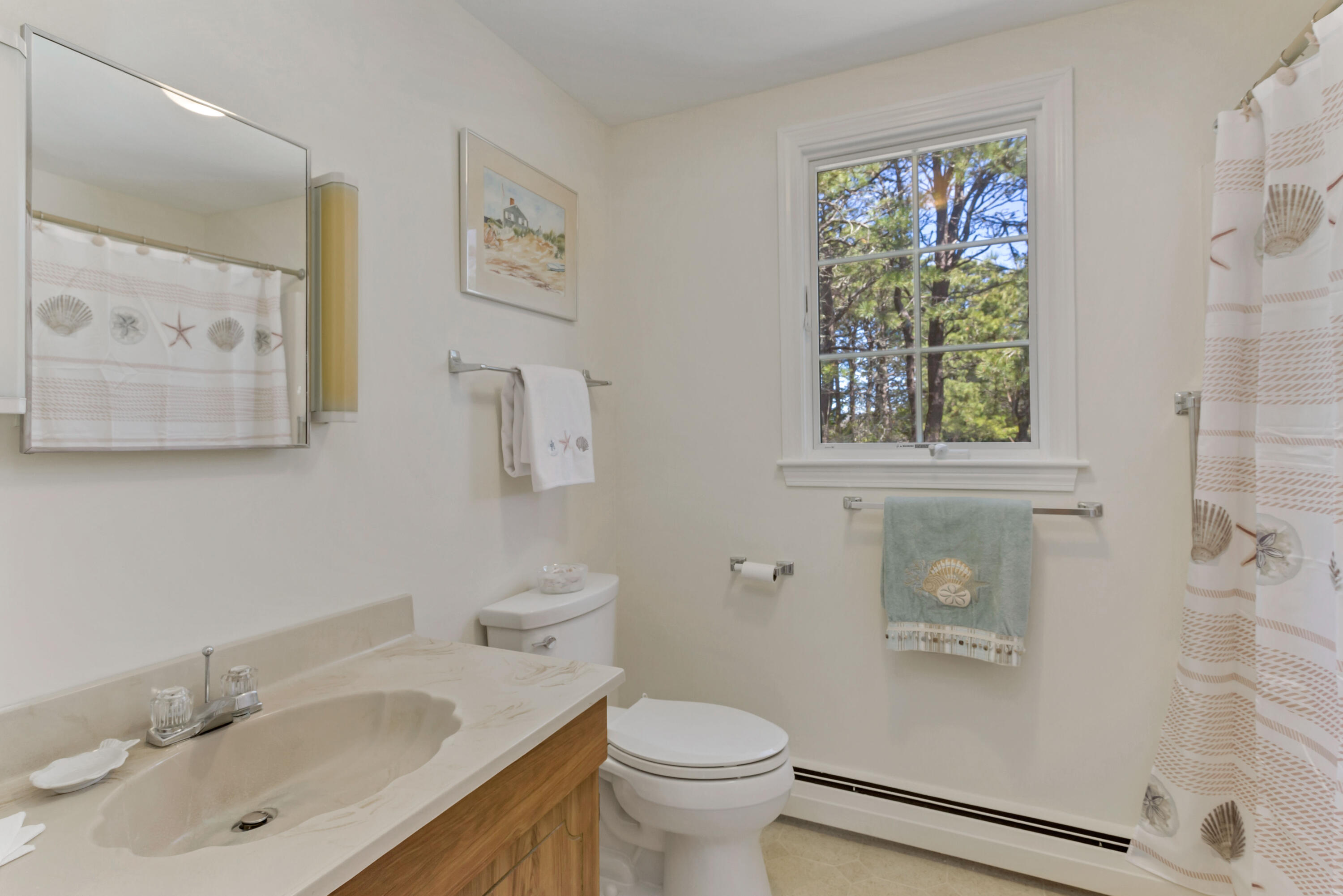 140 Salt Works Road Eastham, MA 02642 - Photo 20 of 49 a bathroom with a sink toilet and window