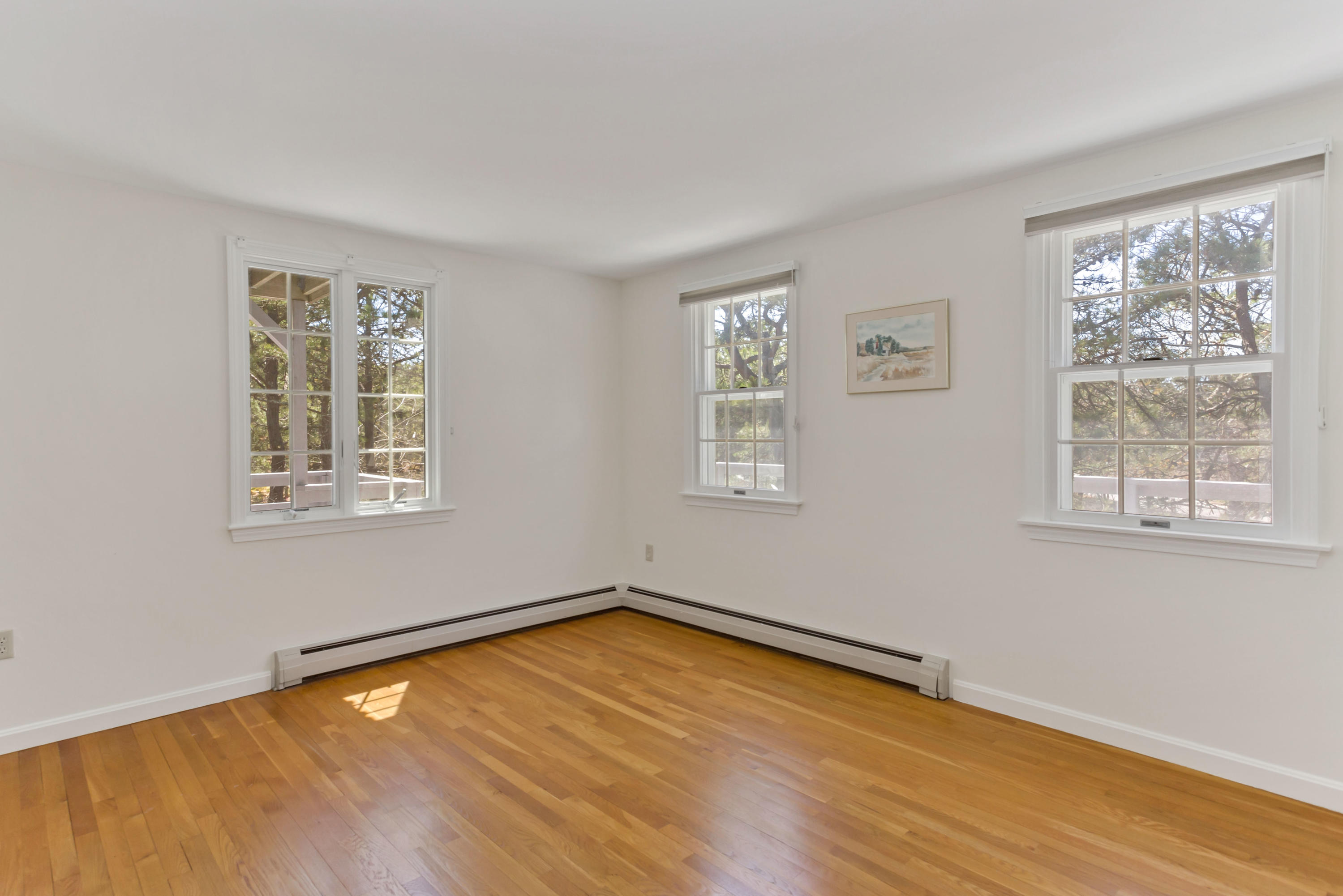 140 Salt Works Road Eastham, MA 02642 - Photo 21 of 49 a view of a room with wooden floor and window