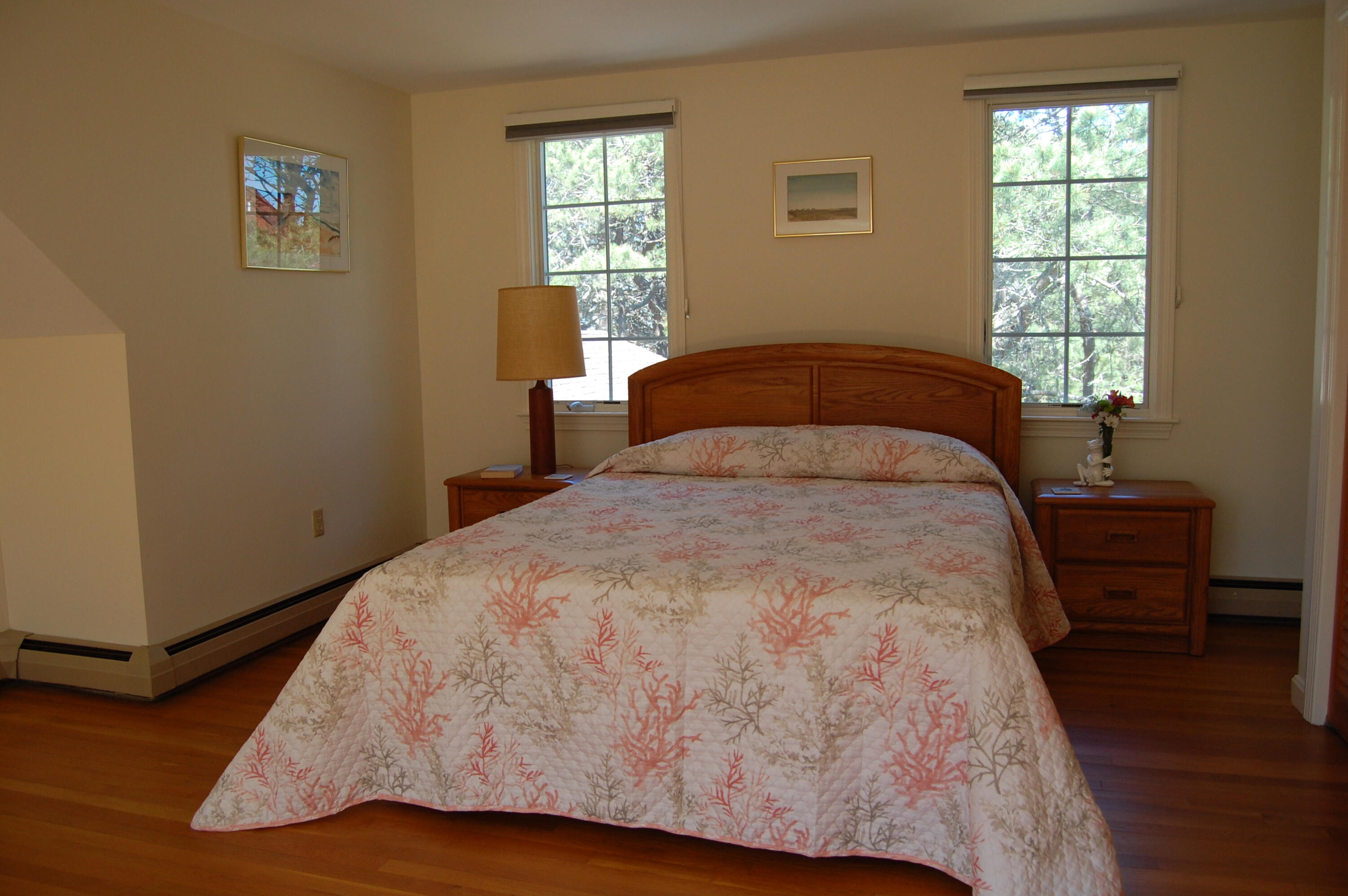 140 Salt Works Road Eastham, MA 02642 - Photo 29 of 49 a bed sitting in a bedroom next to a window