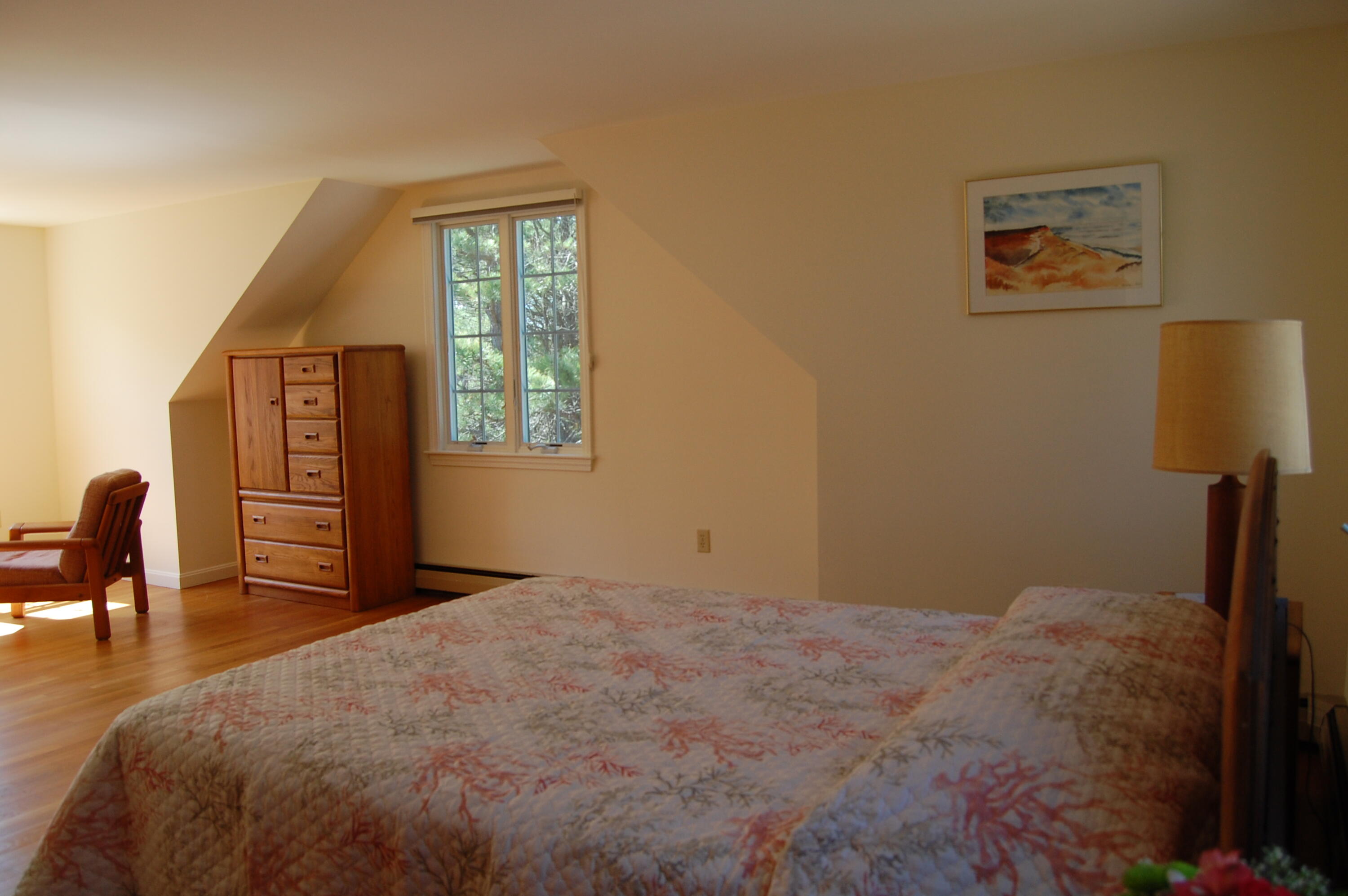 140 Salt Works Road Eastham, MA 02642 - Photo 33 of 49 a bedroom with a bed and a window