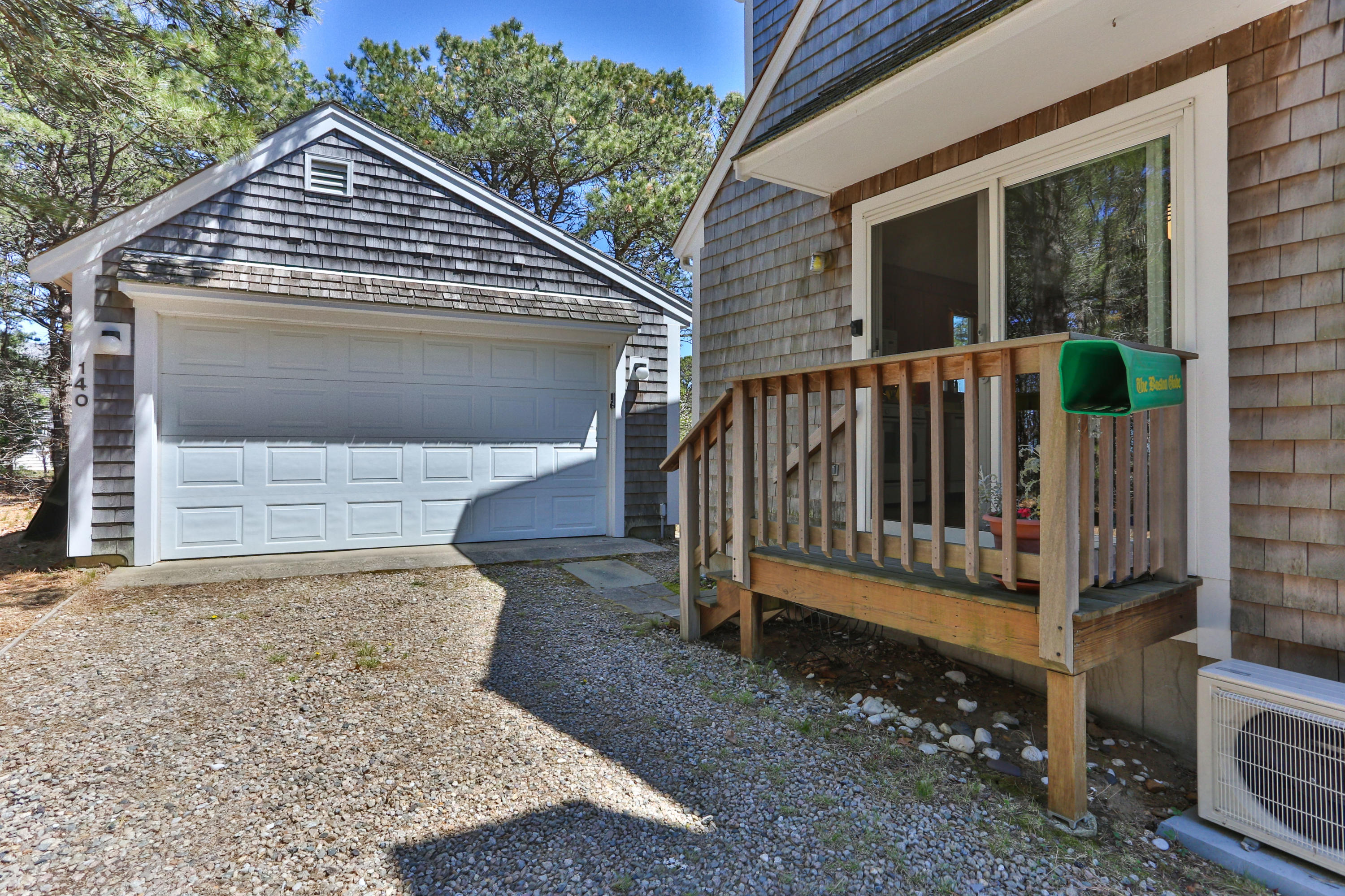 140 Salt Works Road Eastham, MA 02642 - Photo 40 of 49 a view of house with a small yard and wooden fence