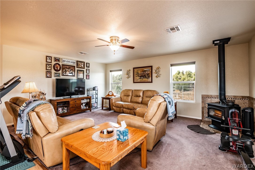 2960 North Willows Ranch Road Kingman, AZ 86401 - Photo 6 of 50 a living room with furniture a flat screen tv and a window