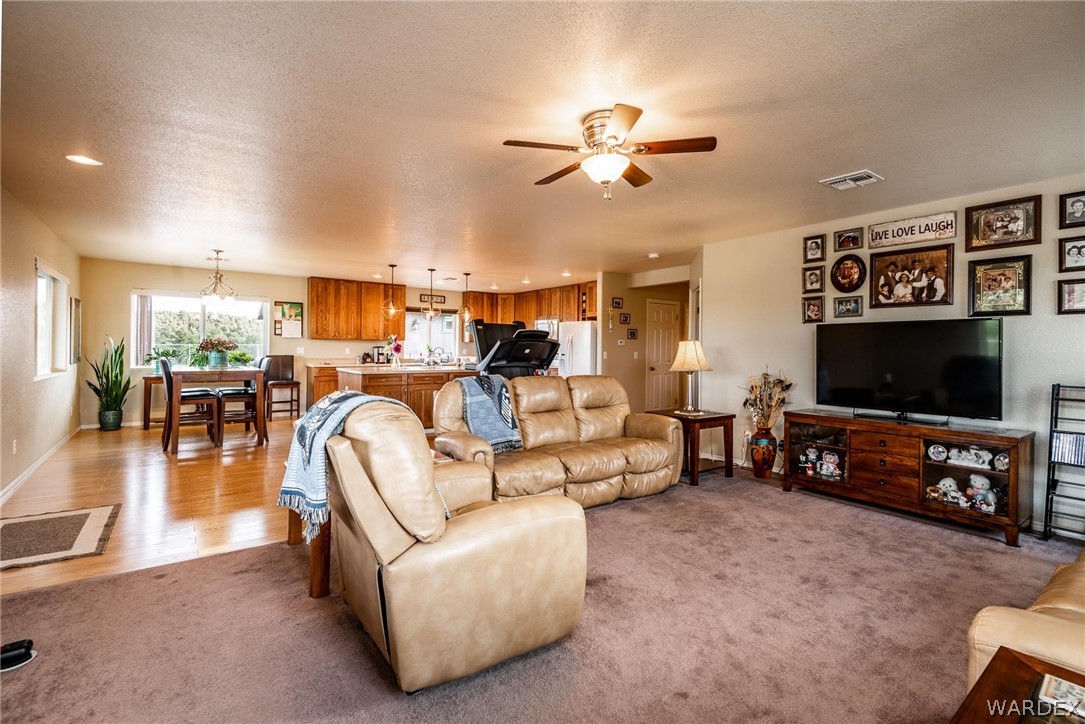 2960 North Willows Ranch Road Kingman, AZ 86401 - Photo 8 of 50 a living room with furniture and a flat screen tv