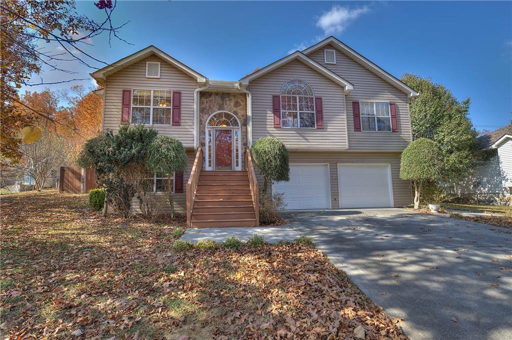 230 Hunters Crossing Calhoun, GA 30701 - Photo 1 of 1 a front view of a house with garden