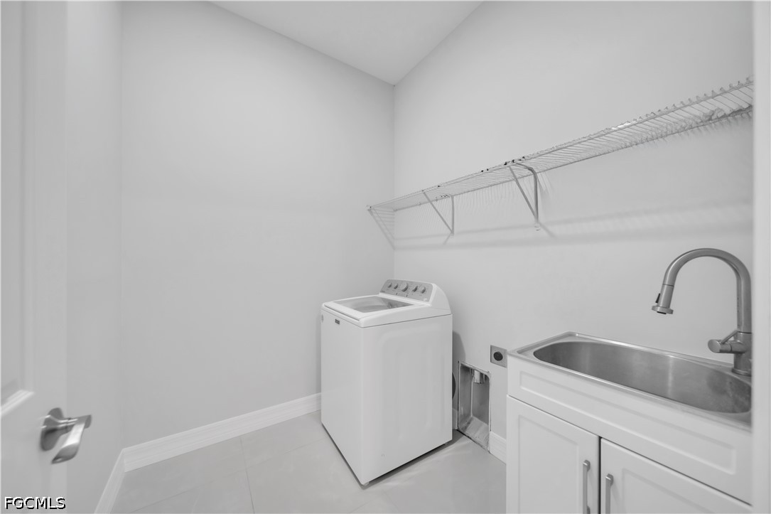 3509 38th Street Southwest Lehigh Acres, FL 33976 - Photo 12 of 47 a utility room with dryer and washer