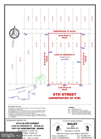 a black and white photo of a black gate