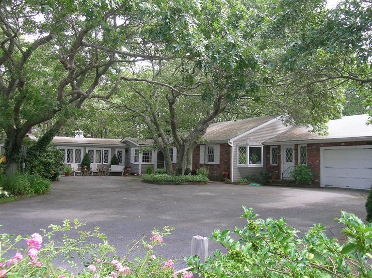 9 Arrowhead Farm Road Truro, MA 02666 - Photo 1 of 30 front view of a house with a yard