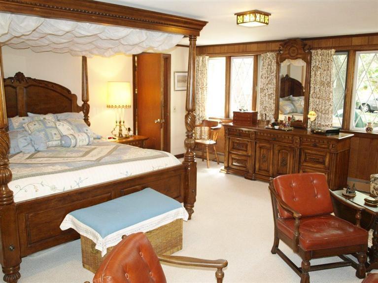 9 Arrowhead Farm Road Truro, MA 02666 - Photo 13 of 30 a bedroom with furniture and large windows