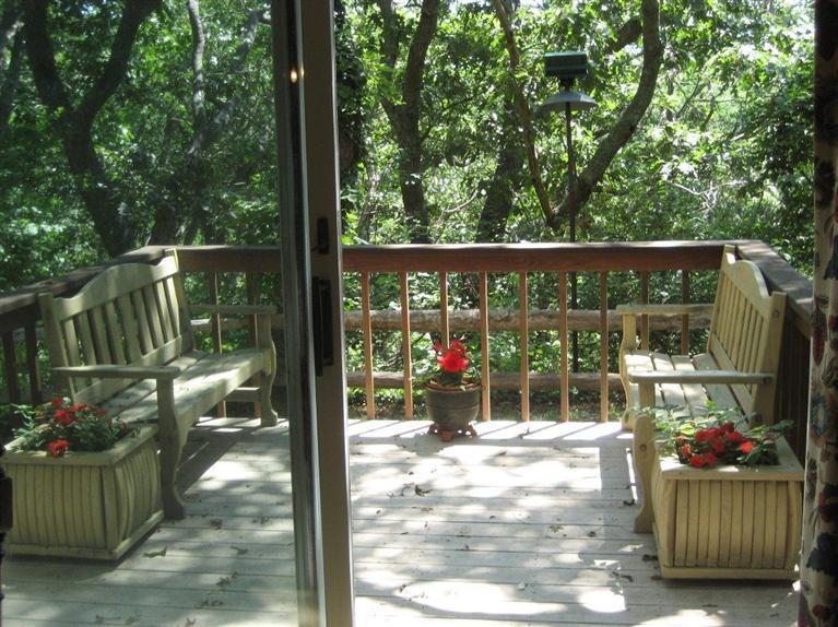 9 Arrowhead Farm Road Truro, MA 02666 - Photo 2 of 30 a view of a balcony with chairs