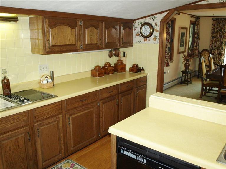 9 Arrowhead Farm Road Truro, MA 02666 - Photo 24 of 30 a kitchen with a sink and cabinets