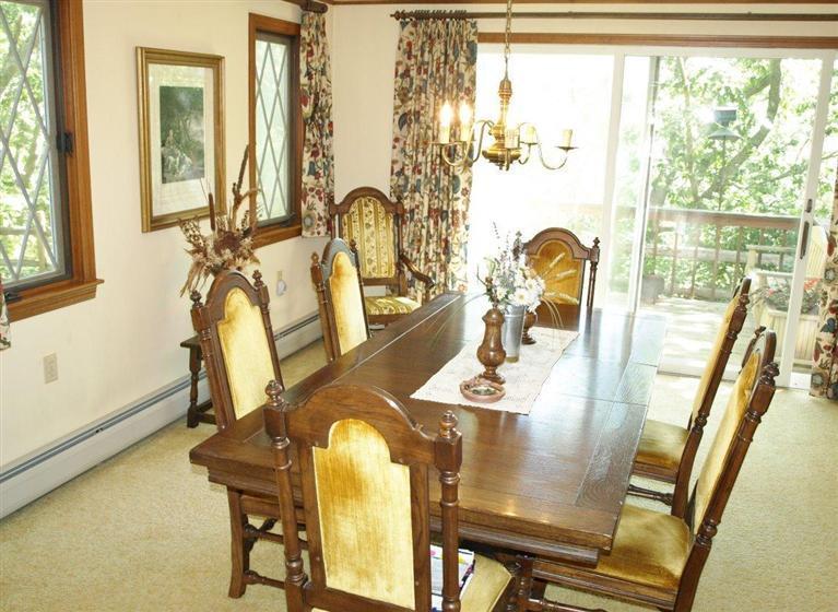 9 Arrowhead Farm Road Truro, MA 02666 - Photo 25 of 30 a view of a dining room with furniture and a window