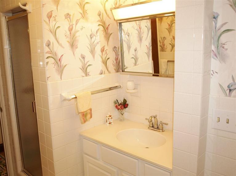 9 Arrowhead Farm Road Truro, MA 02666 - Photo 27 of 30 a bathroom with a sink and a mirror