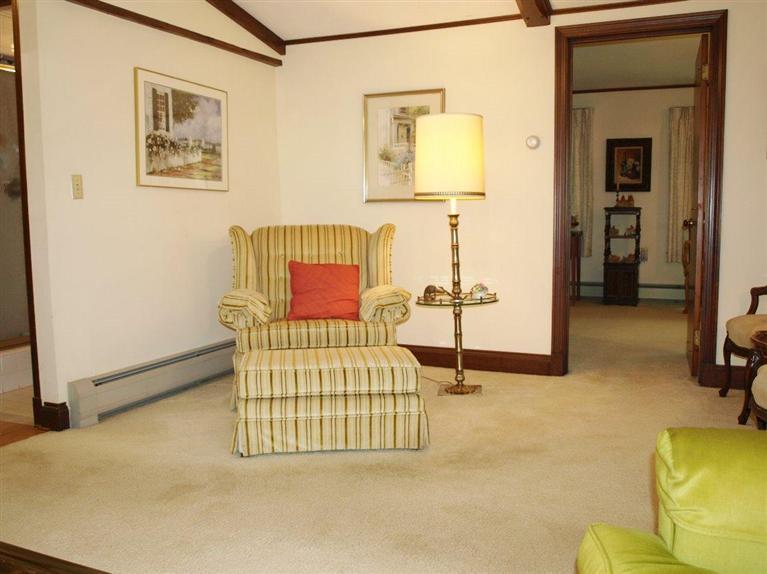 9 Arrowhead Farm Road Truro, MA 02666 - Photo 7 of 30 a bedroom with a bed and lamp