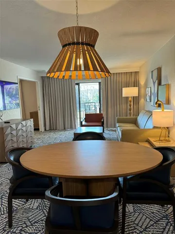 a dining room with a table and chairs