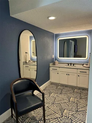 a bathroom with a toilet a sink and shower