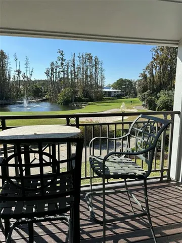 a view of a chairs and table on the terrace