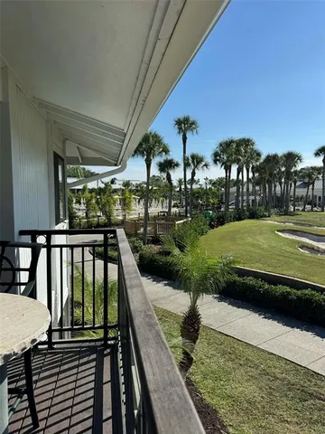 a view of a swimming pool and a yard