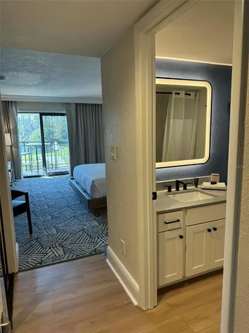 a en suite bathroom with a sink and a mirror