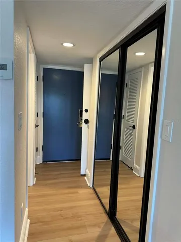 wooden floor in a hall with a mirror