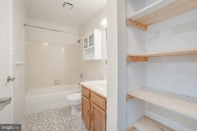 a bathroom with a shower a toilet and a bathtub