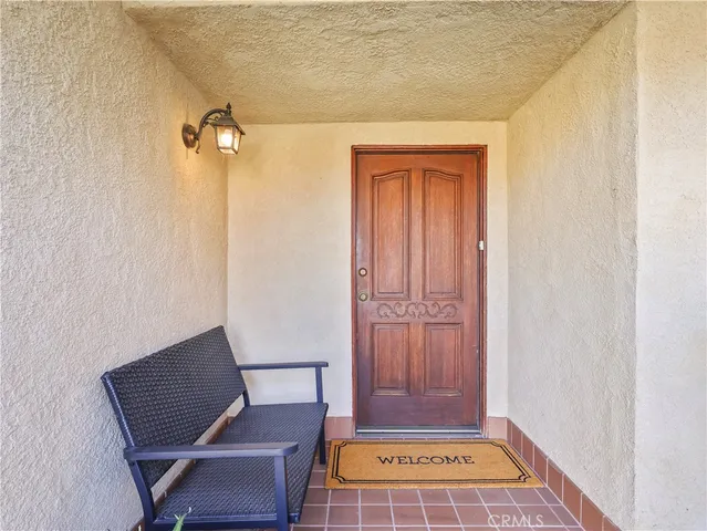 a view of room with a chair and door