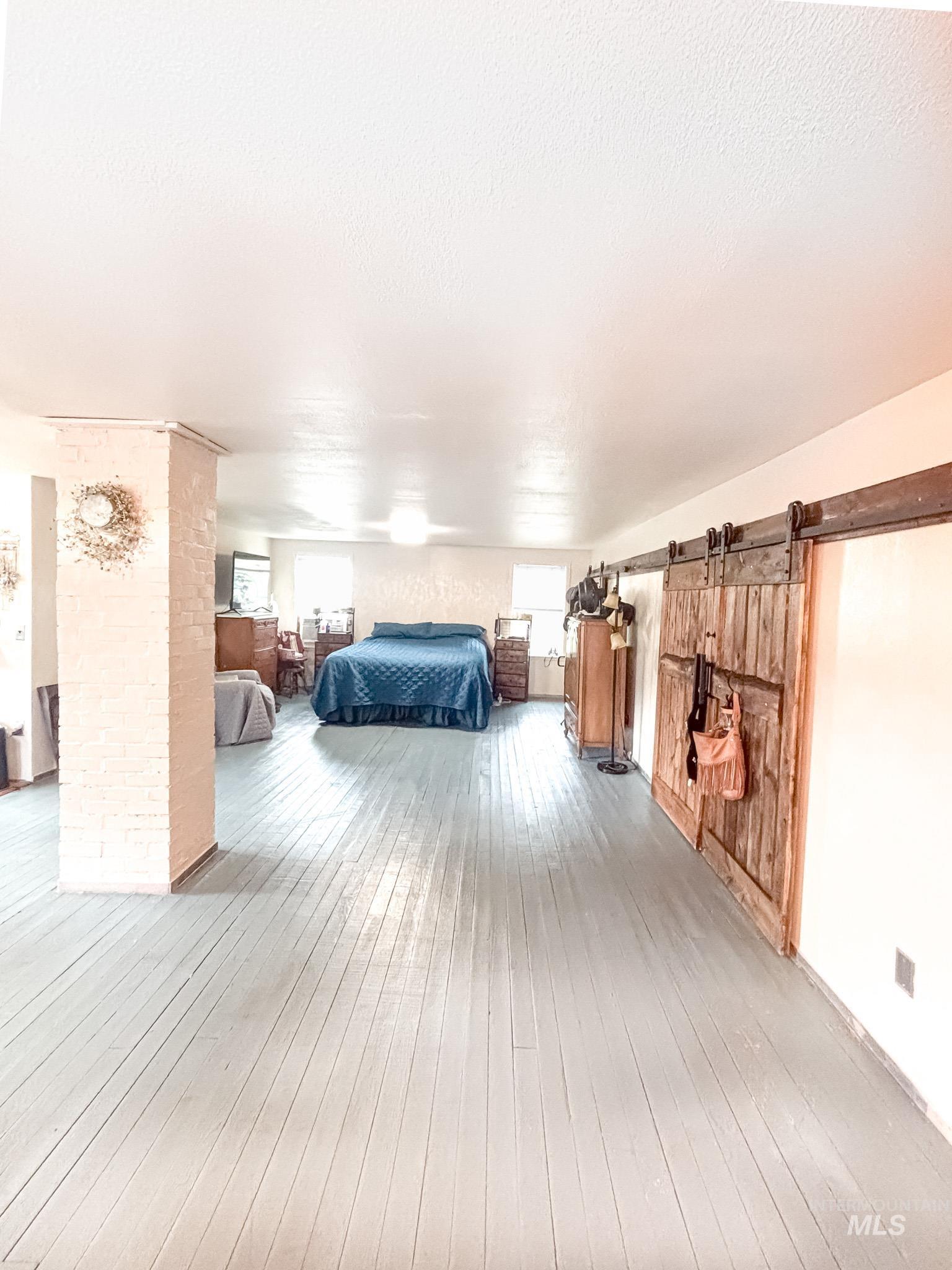 1995 Glenwood Road Kamiah, ID 83536 - Photo 20 of 38 Spacious room featuring painted wood-finish flooring