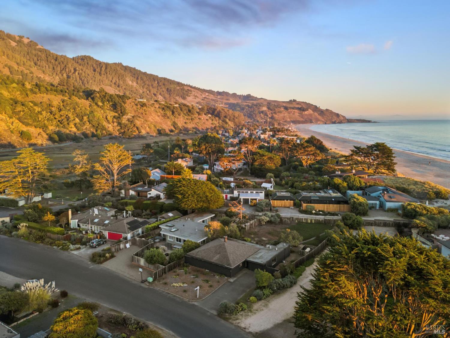 an aerial view of residential house and ocean