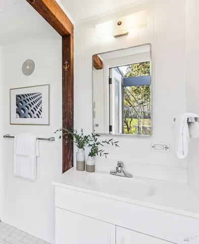 a bathroom with a sink and a mirror