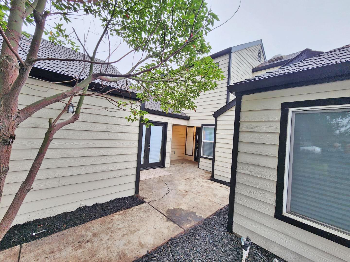 1963 Pontelli Court Stockton, CA 95207 - Photo 23 of 25 a view of a house with a door and wooden walls