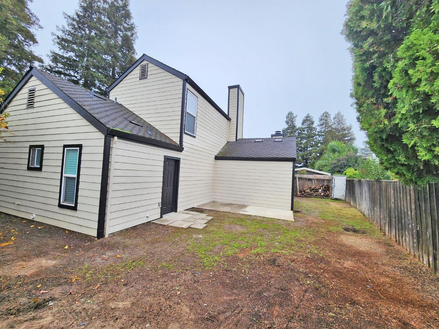 1963 Pontelli Court Stockton, CA 95207 - Photo 25 of 25 a view of a small house with wooden fence