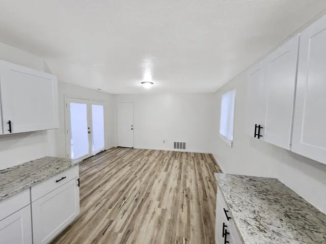 a view of kitchen and wooden floor