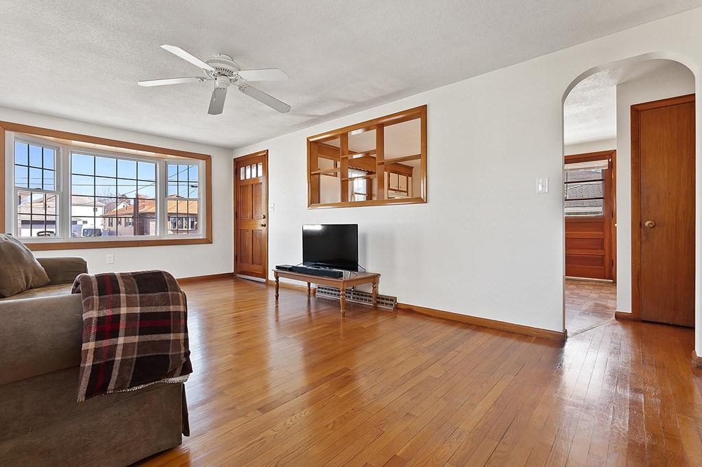 20 Davis Terrace Peabody, MA 01960 - Photo 13 of 25 a living room with furniture and a flat screen tv