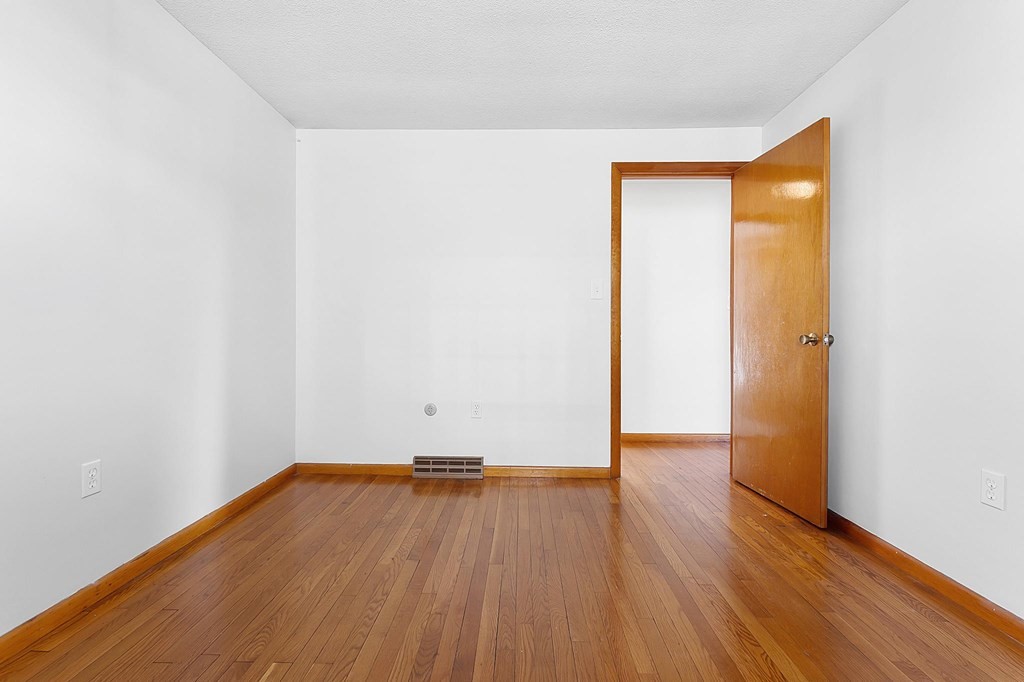 20 Davis Terrace Peabody, MA 01960 - Photo 19 of 25 an empty room with wooden floor and closet